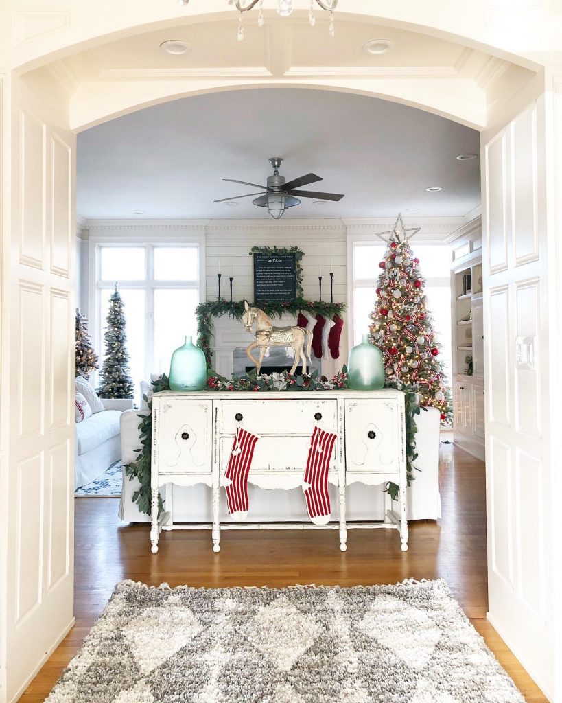 festive christmas entryway with stockings