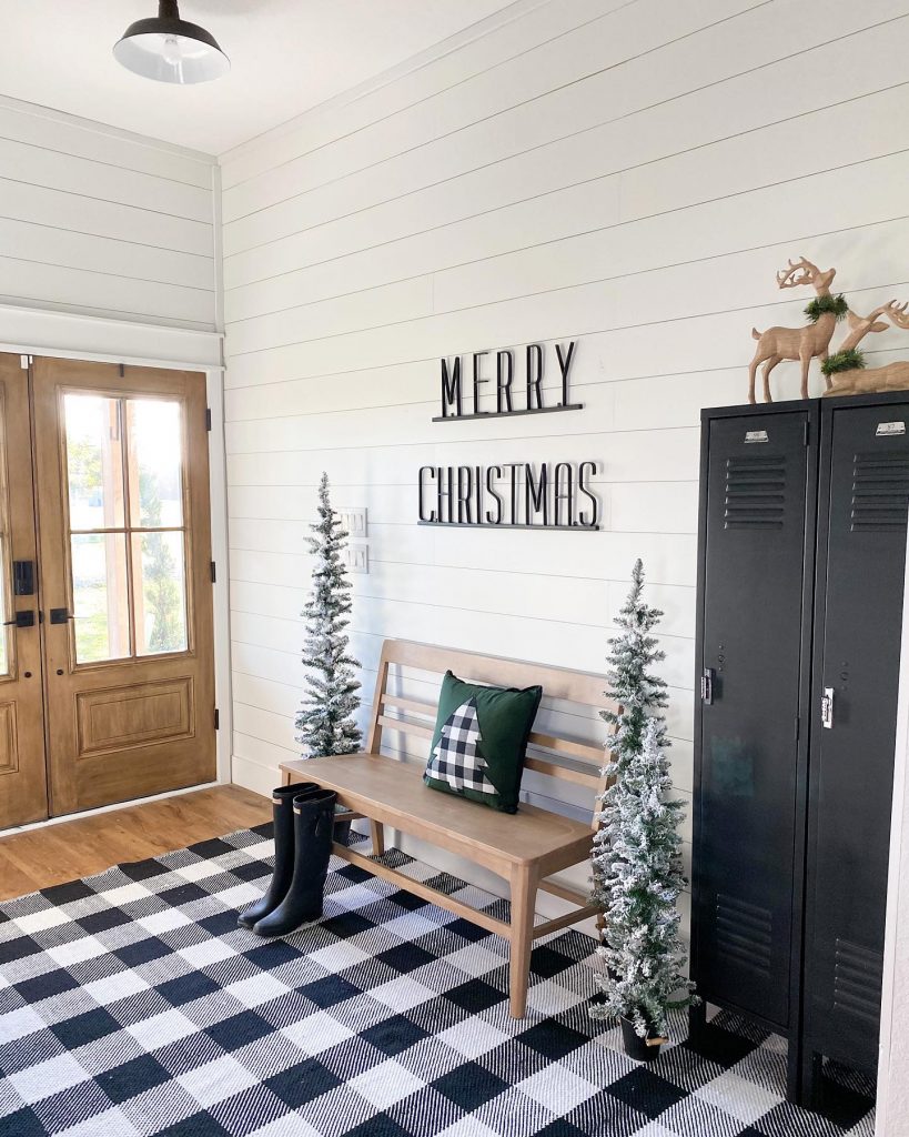 merry christmas entryway with plaid decor