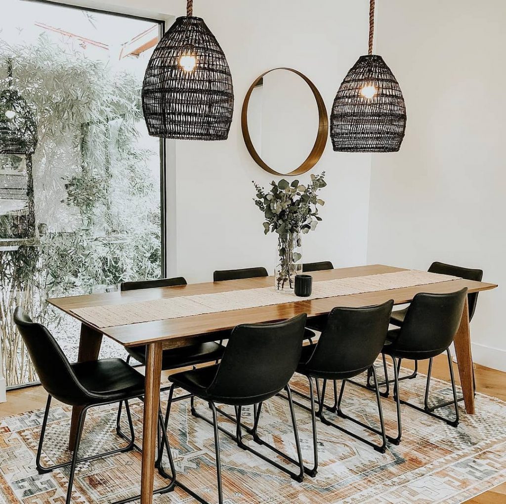 wood dining table with black chairs