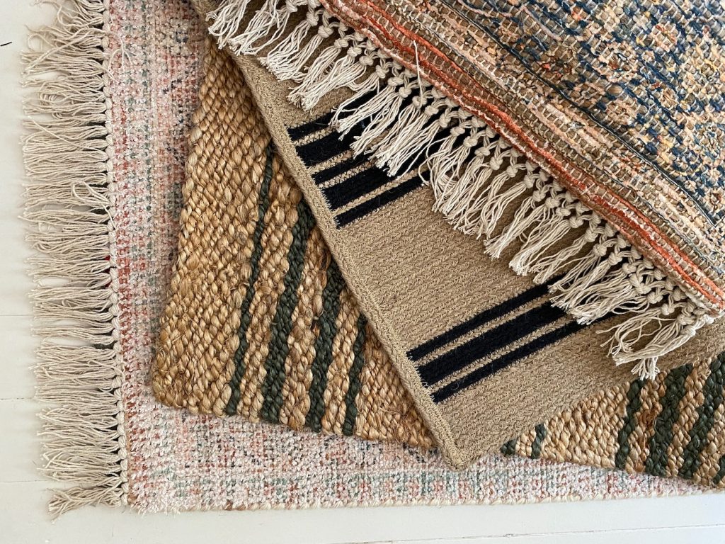 up close view of four flatweave rugs