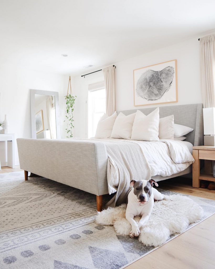 This pooch is extra happy to have a rug beside her parent's bed.