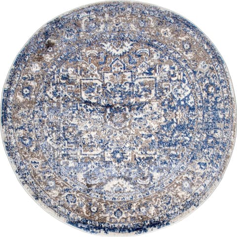 Isolated view of Light Blue Round Faded Star Petal Emblem Rug, showcasing its design